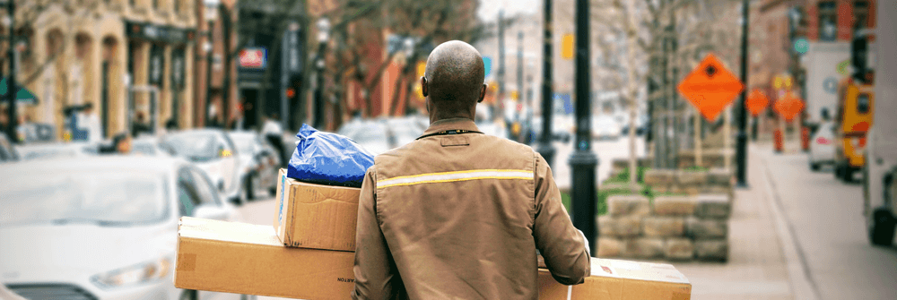 man carrying packages for delivery