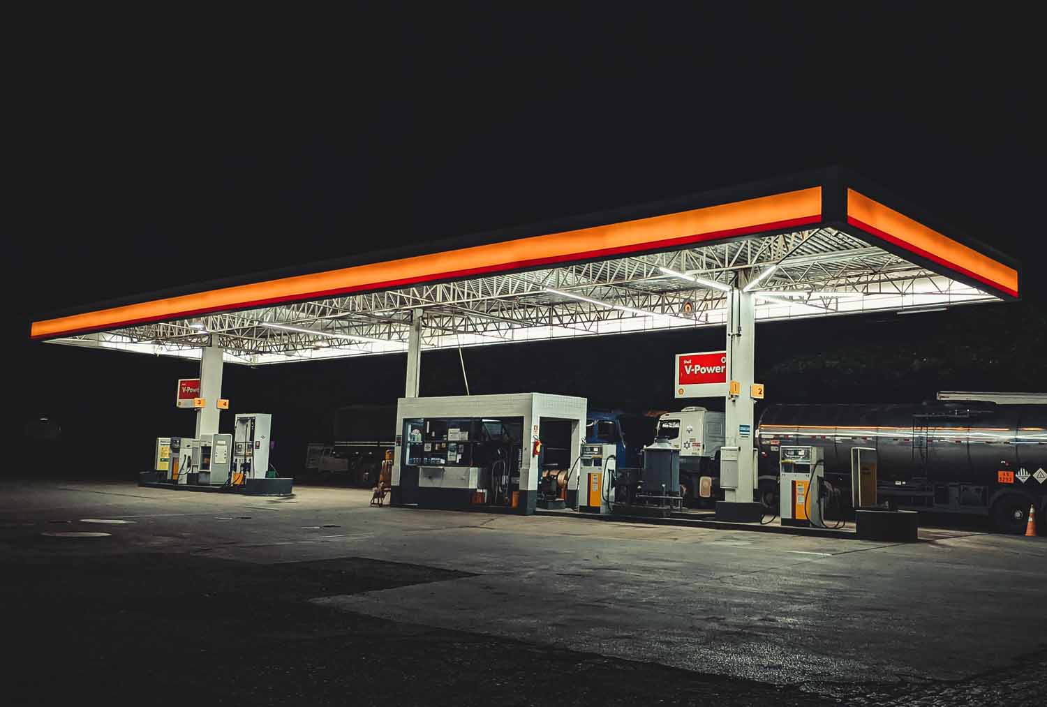 Large truck fueling up at a gas station